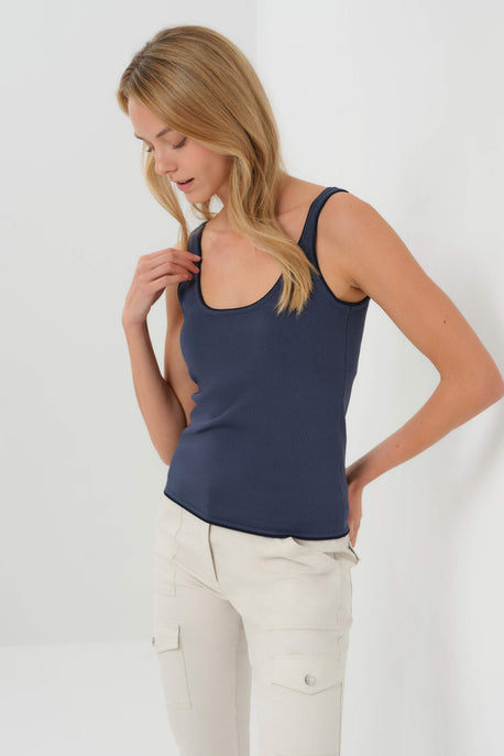 Studio shot of a model wearing the Tina Tank