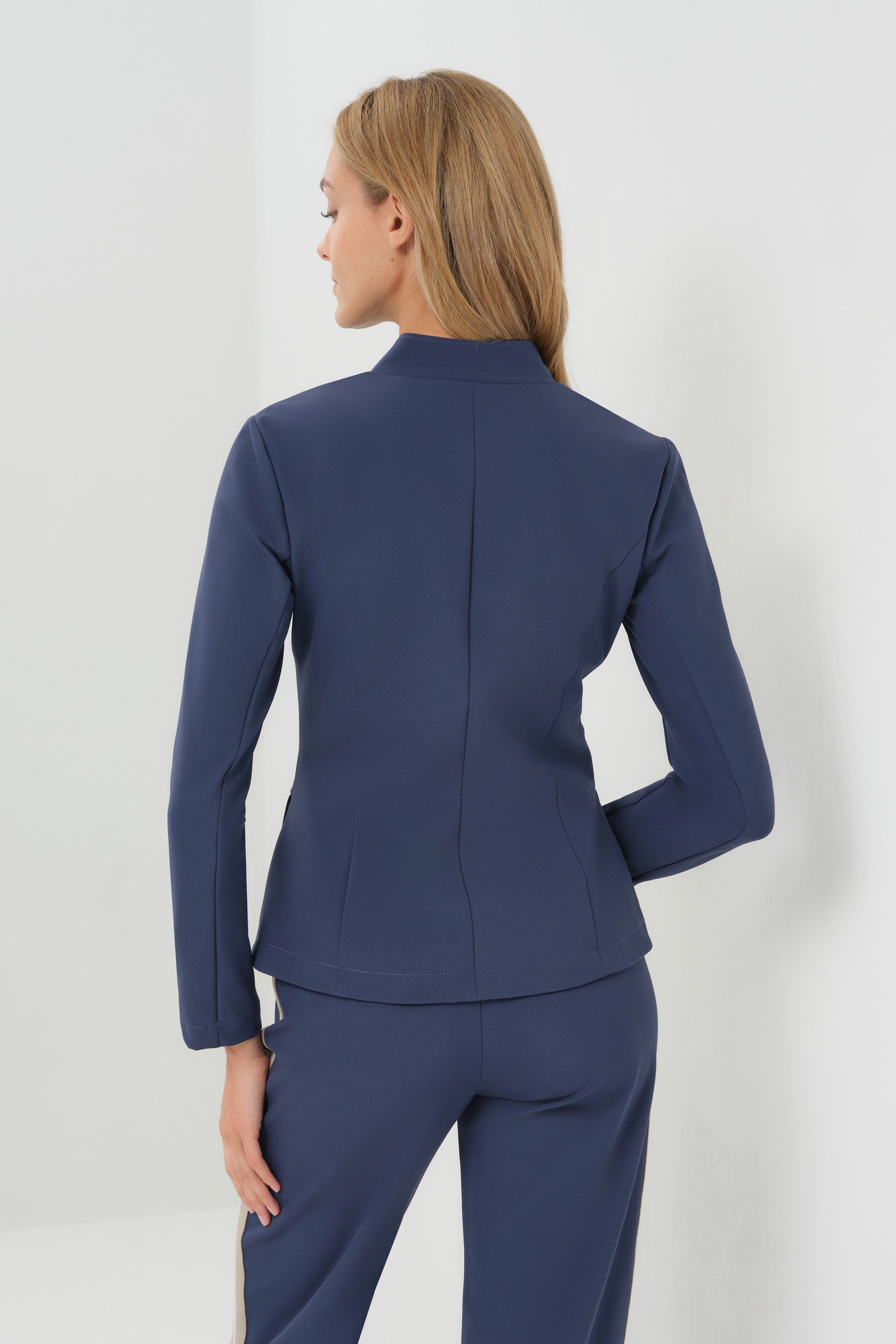 Studio Image of model wearing the Gisela Aeroflow Zip Front Twill Blazer