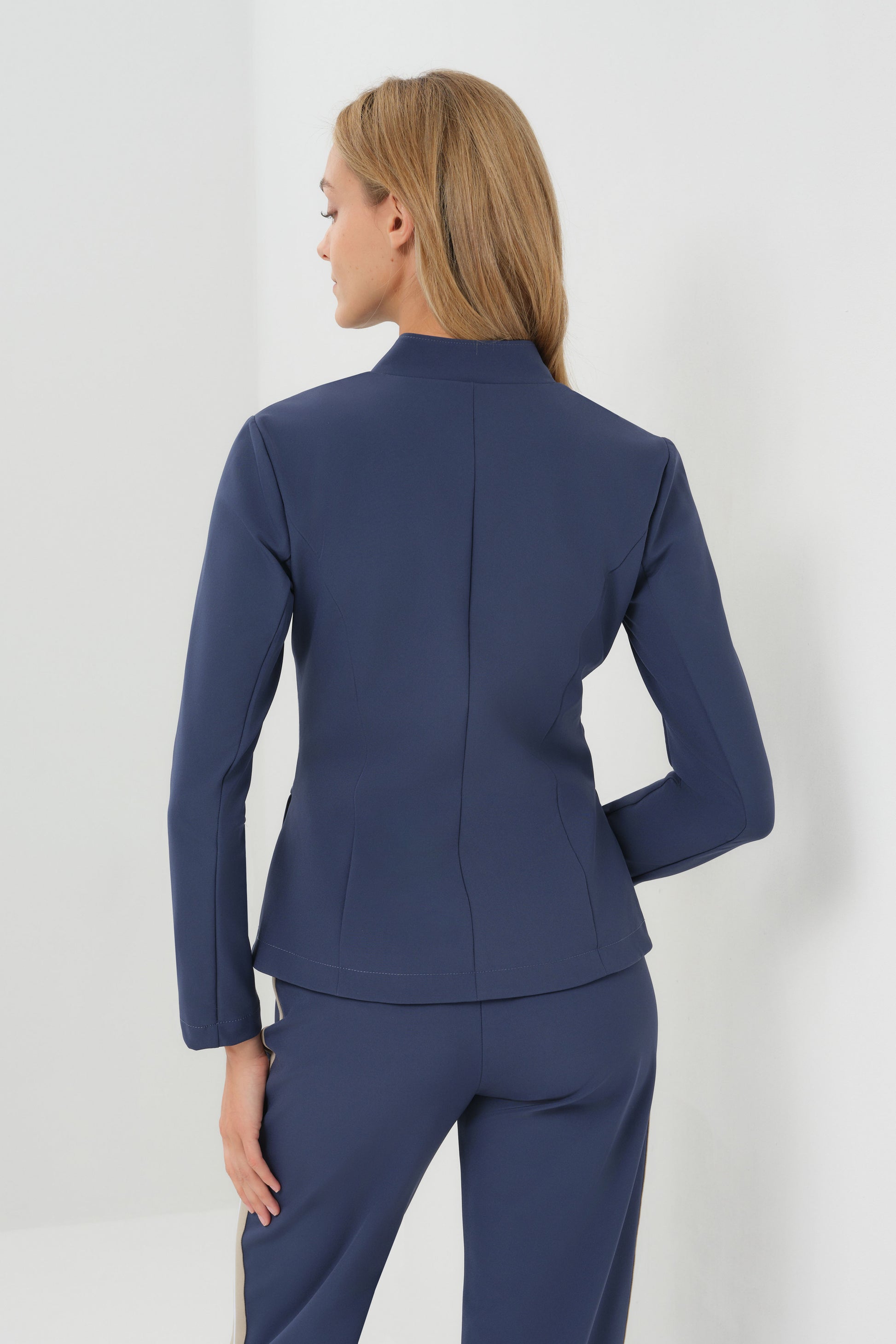 Studio Image of model wearing the Gisela Aeroflow Zip Front Twill Blazer