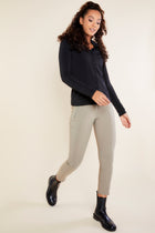 The Best Travel Top. Woman Showing the Front Profile of a Danica Snap On Super Jersey Top in Black